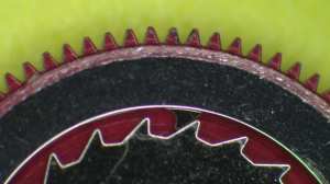 Worn watch movement pivot showing service damage