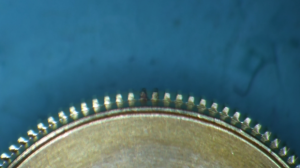 Close view of worn movement component from improper servicing