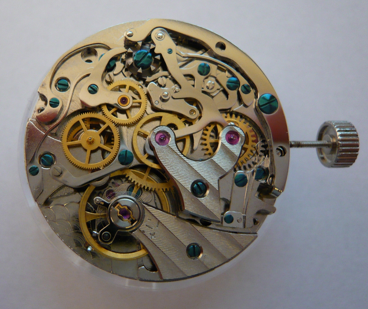 Close view of a mechanical chronograph movement with its column wheel and timing components