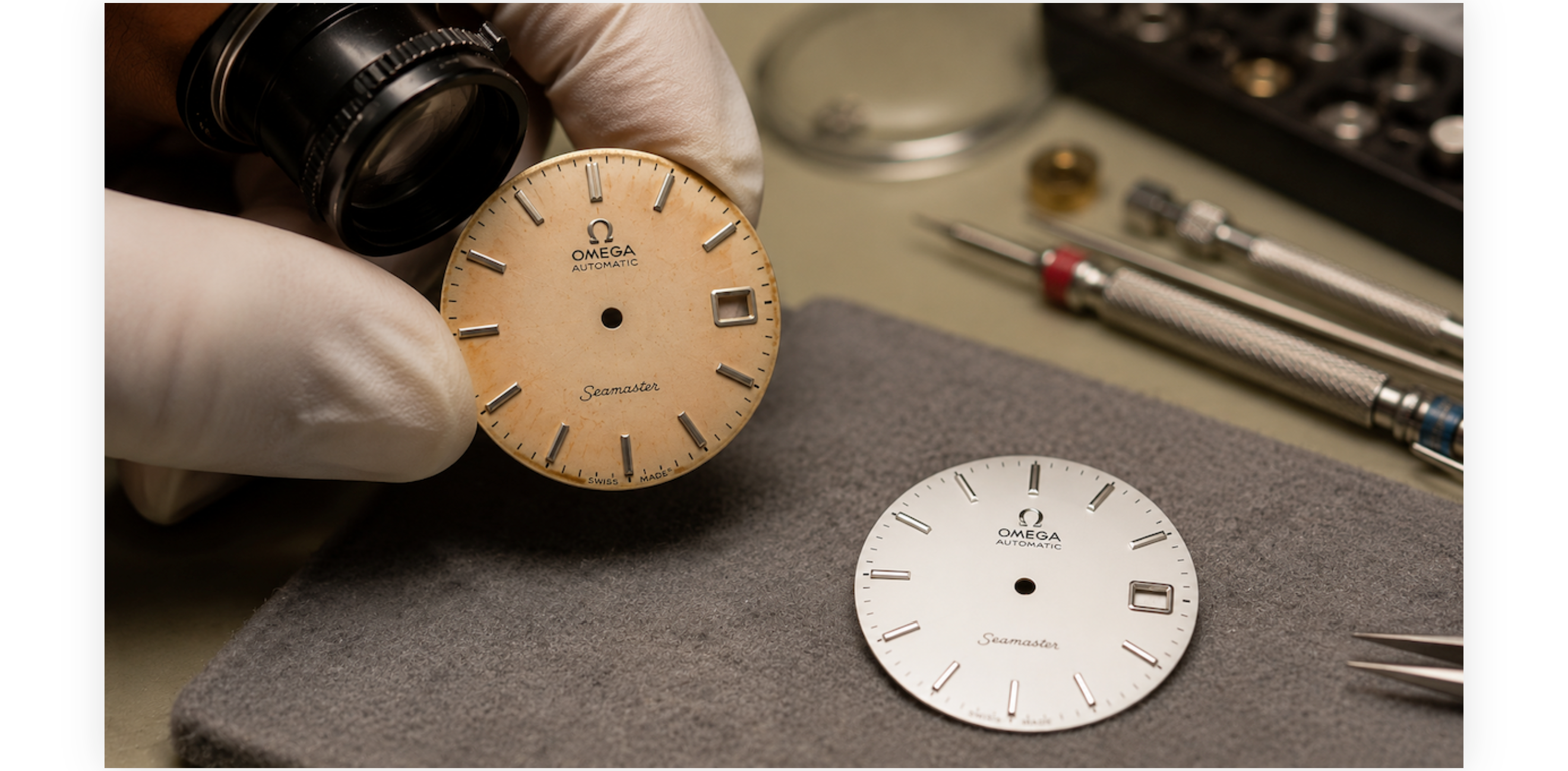 A faded vintage Omega Seamaster dial beside a fresh replacement dial