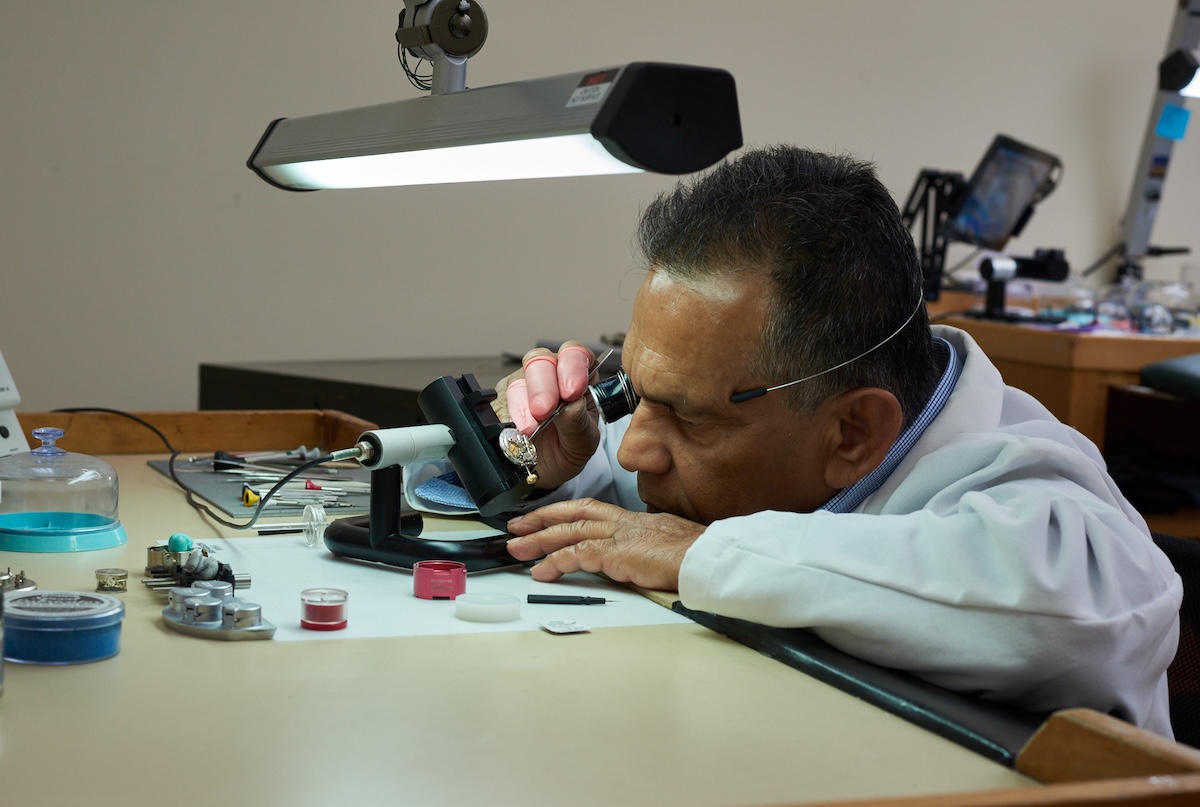 Certified watchmaker at work from the legacy Cartier battery replacement page