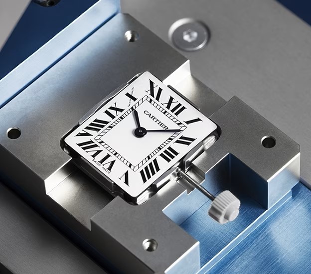 Cartier watch in a repair fixture from the legacy Atlanta Cartier repair page