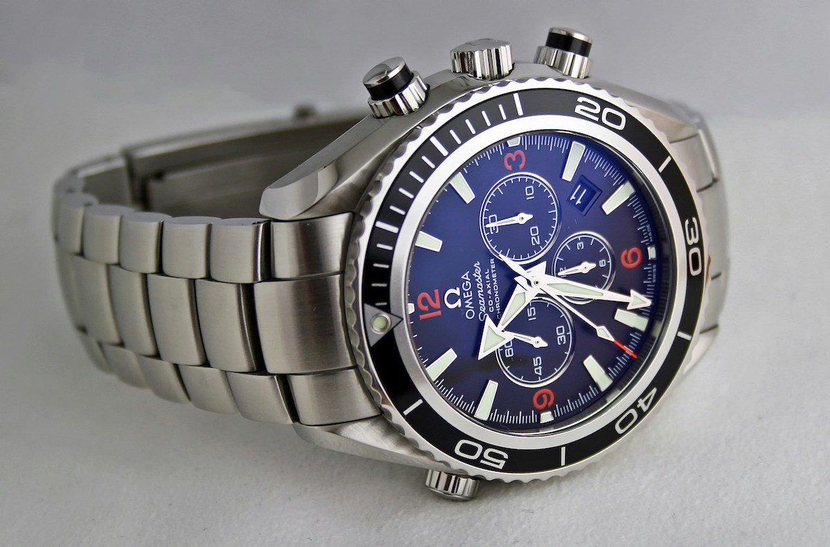 Blue-dial Omega chronograph on bracelet from the legacy Atlanta Omega repair page