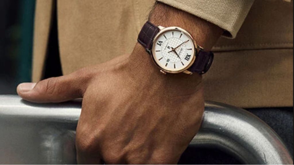 Dress watch fitted with a dark leather replacement strap