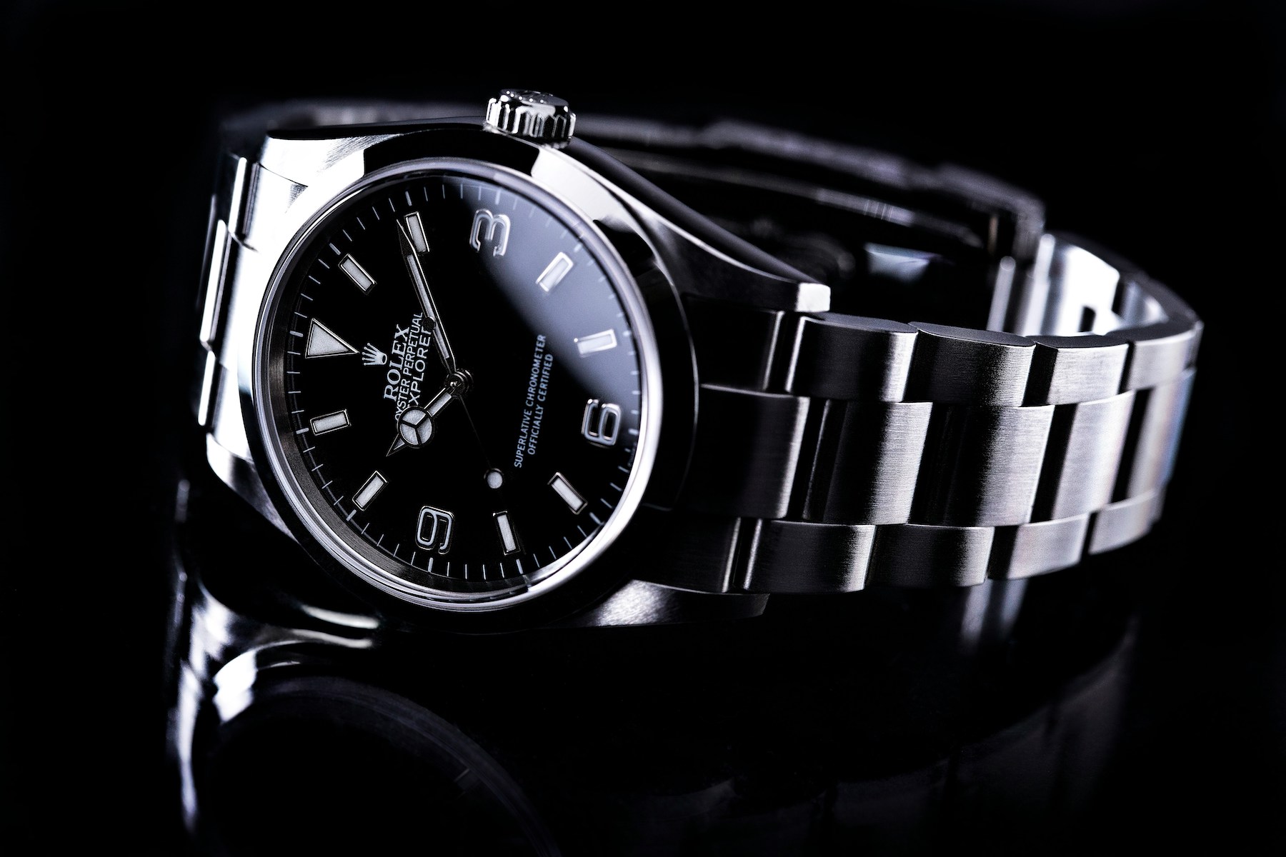 Rolex Explorer watch and bracelet on a black background