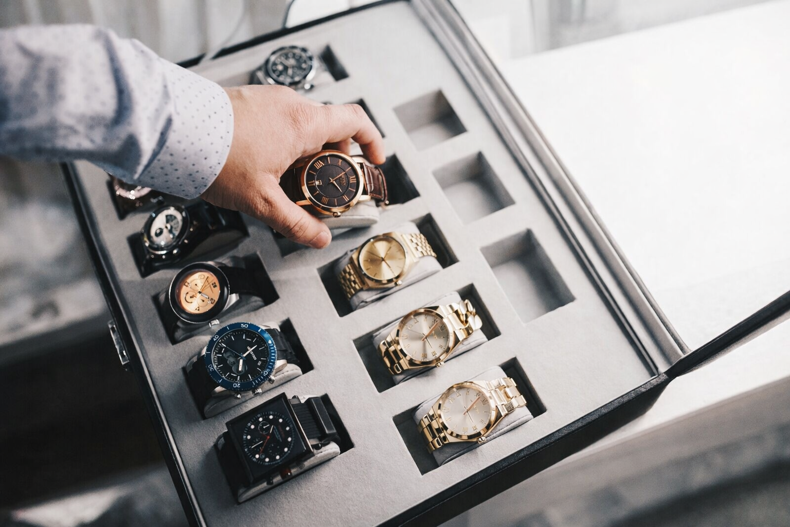 Man reaching for a luxury watch