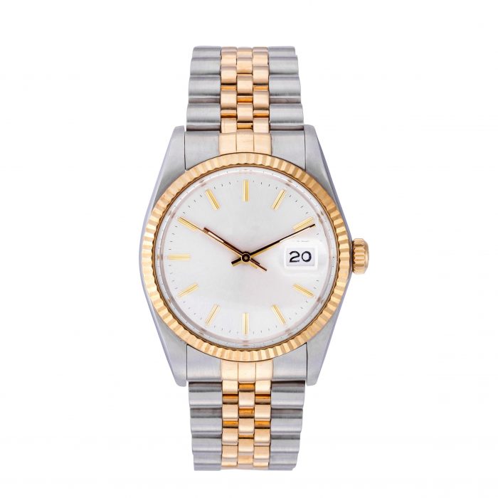 An elegant watch with a silver and golden chain under the lights isolated on a white background